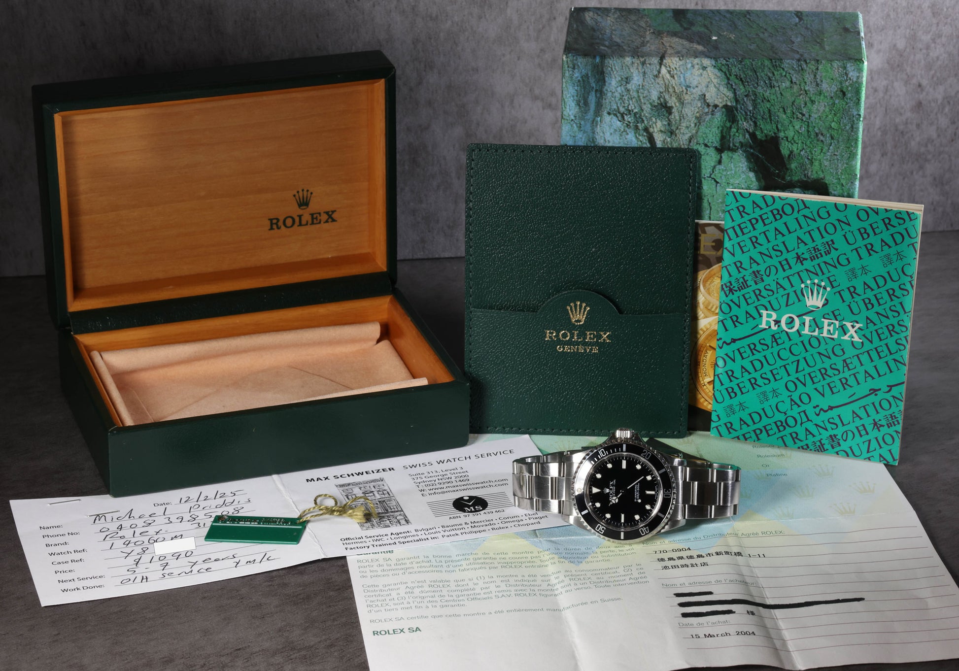 Pre-owned vintage  Rolex Submariner 14060M 40MM 2002 | Box & Papers | Crown Vintage Watches