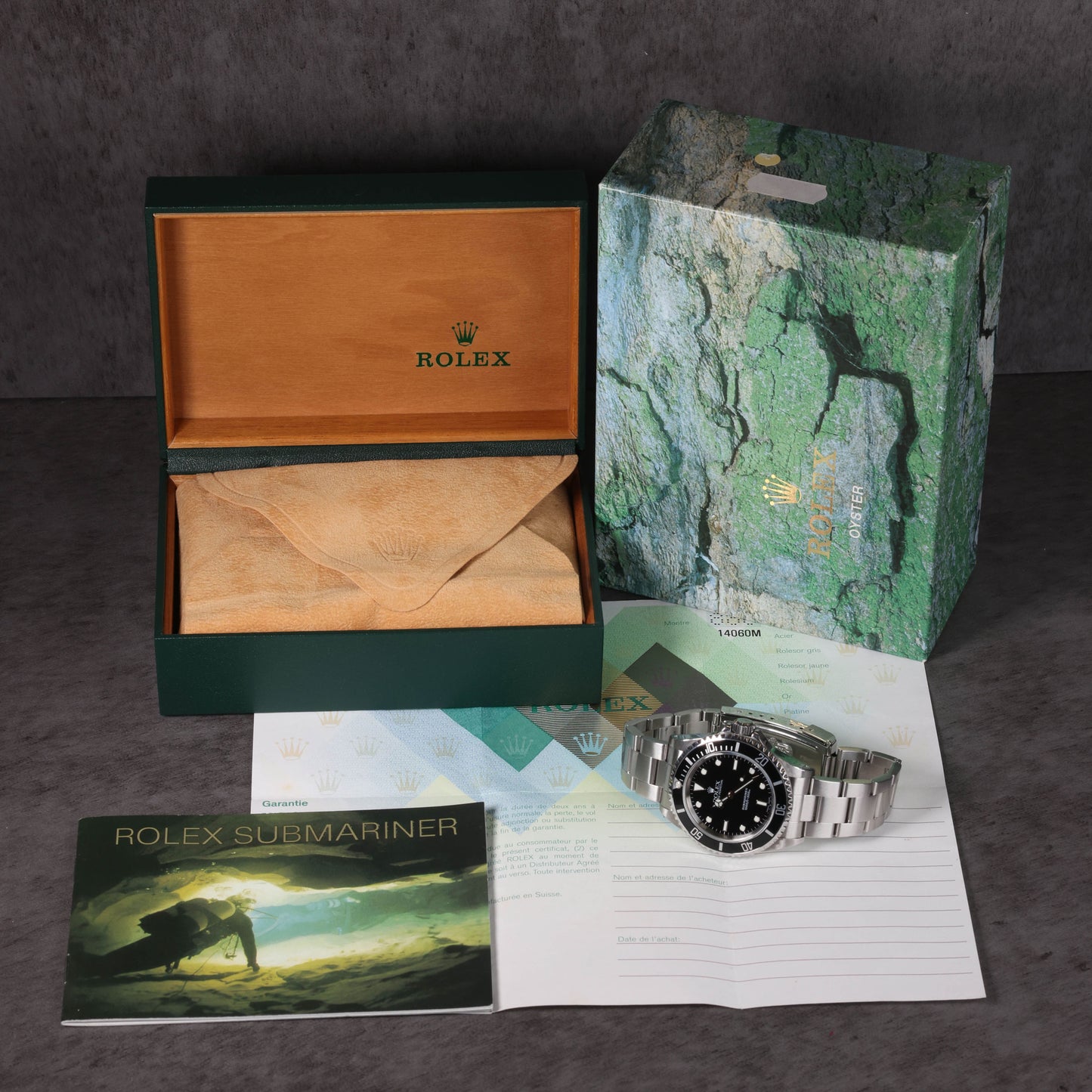 Pre-owned vintage Rolex Submariner 14060M 40mm 2004 Box and Papers | Crown Vintage Watches